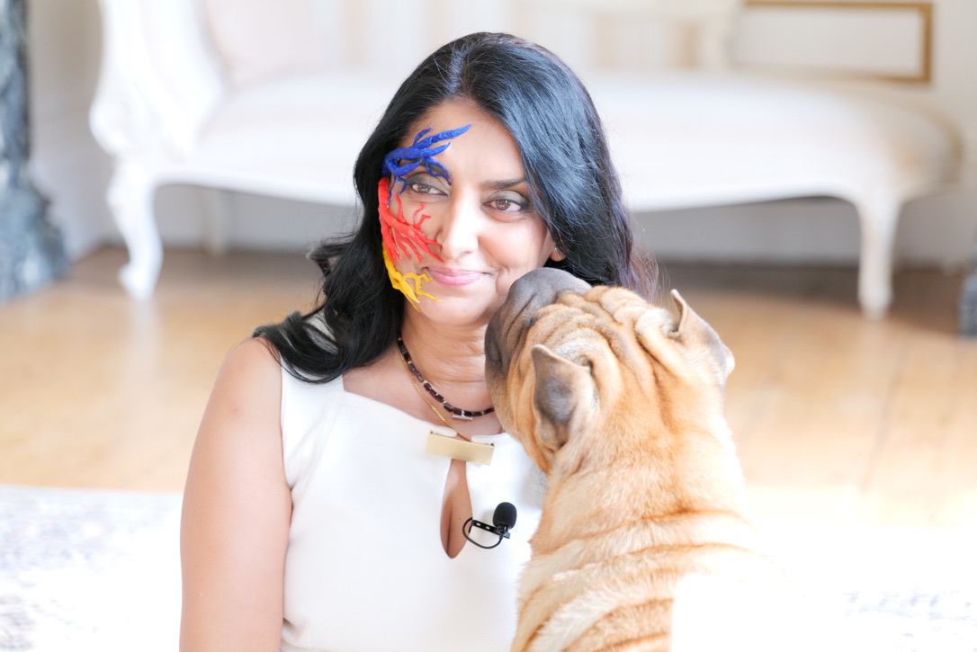 Aneeta Prem with her dog, wearing Face of TN artwork