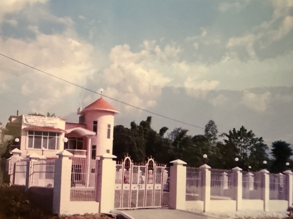 Historic family photograph of the Republic College of India at Jahu, Himachal Pradesh, showing the college building and front gates.
