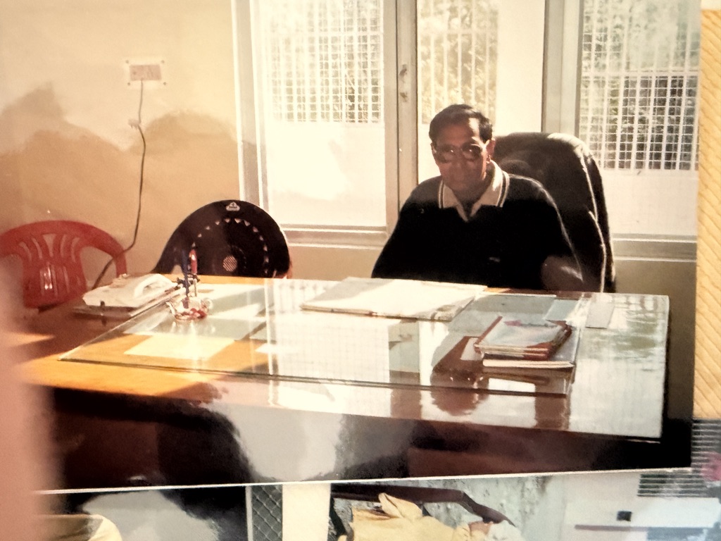 Historic family photograph showing a meeting or class inside the Republic College of India at Jahu.