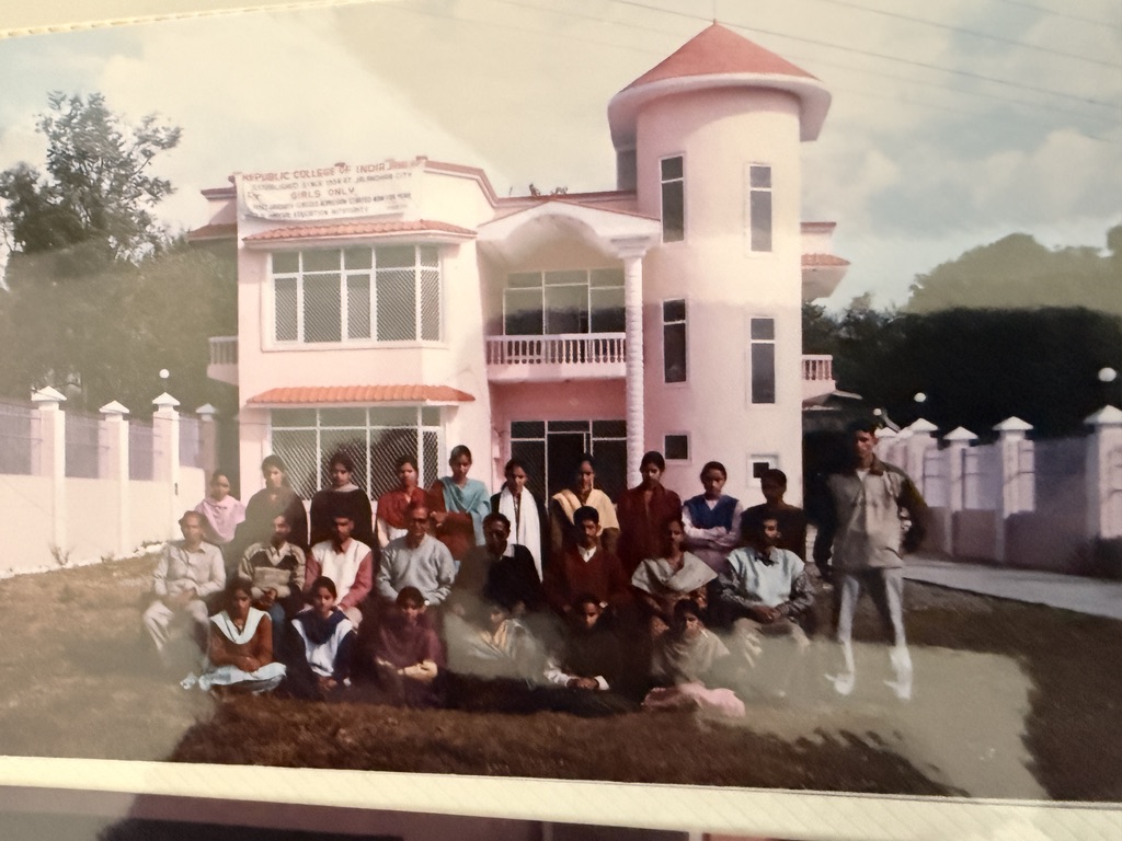Historic family photograph showing a group gathered in front of the Republic College of India at Jahu.