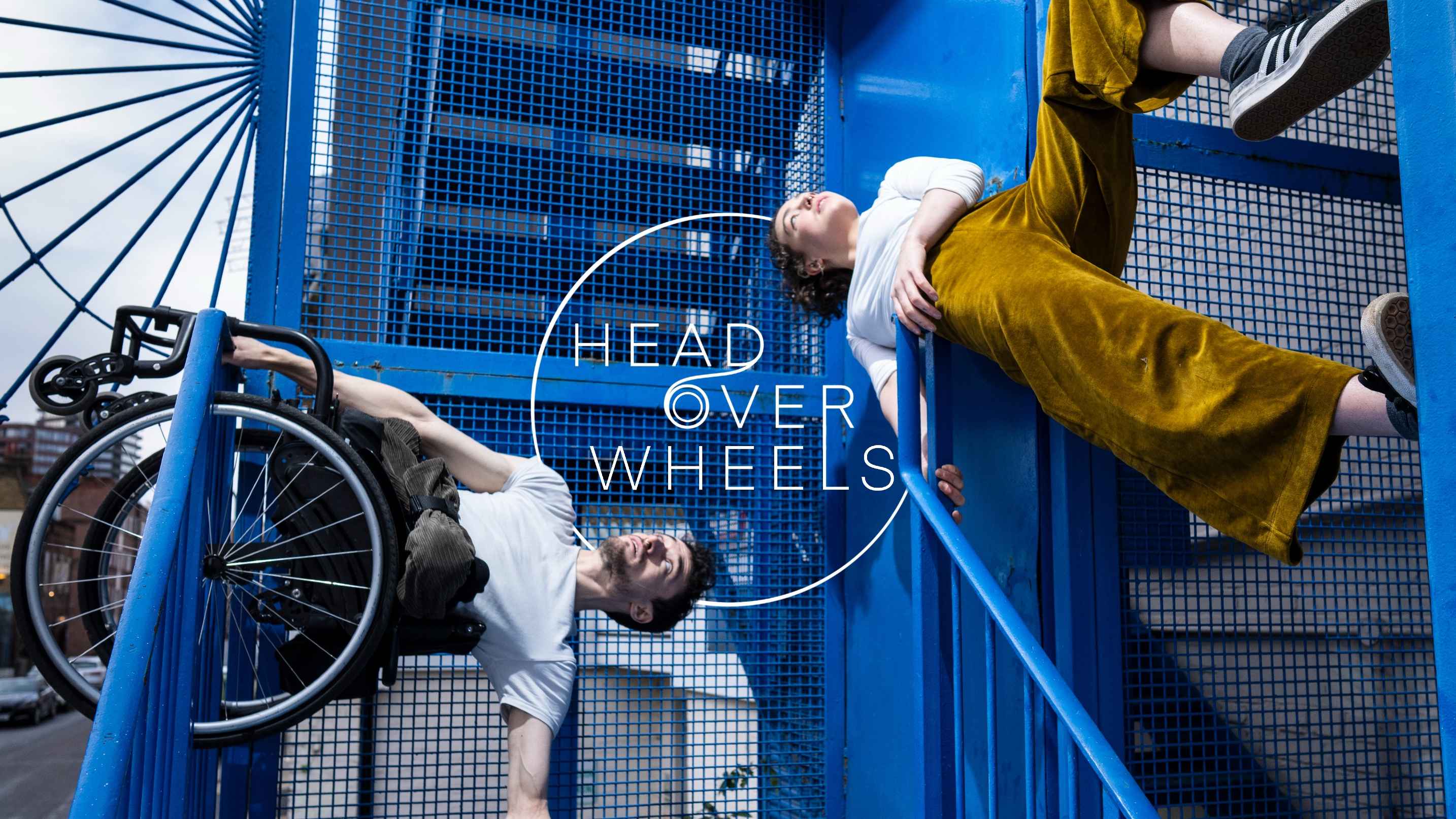 Jonny and Tilly upside down on a blue metal staircase