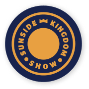 Circular logo with the text 'Sunside Kingdom Show' surrounding a solid orange circle, on a navy blue background.