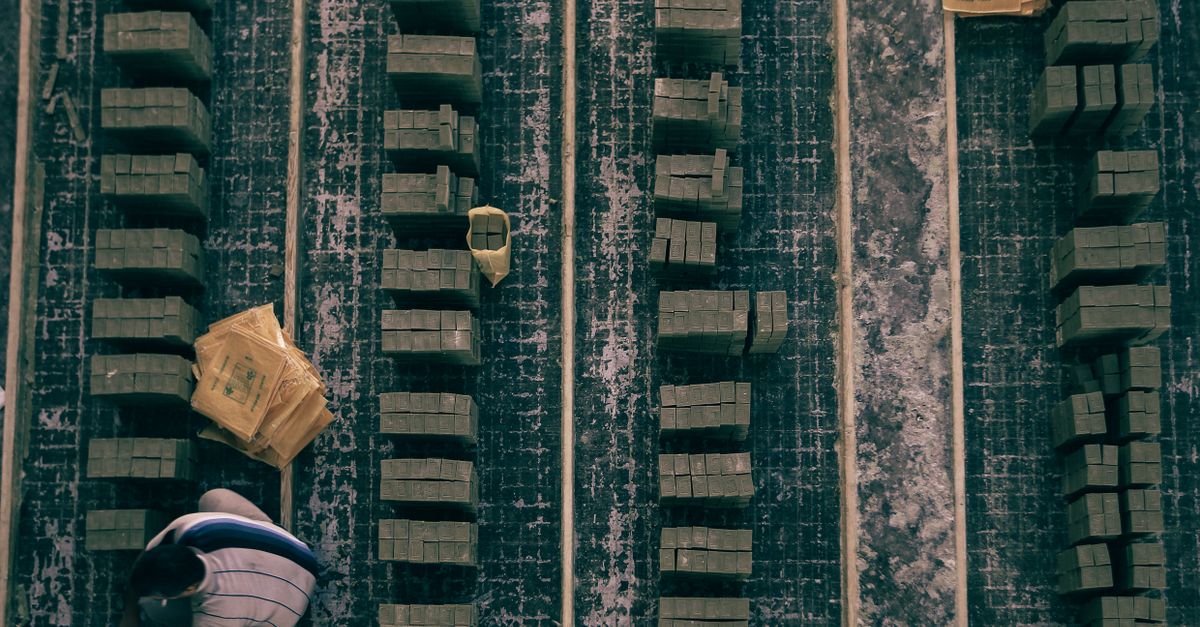 Top view of stacked wooden blocks in an industrial setting, showcasing alignment and organization.