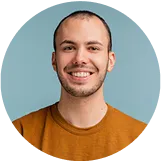 Man in orange shirt smiling