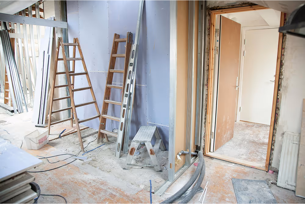 home getting refurbished with ladders and ripped out floors