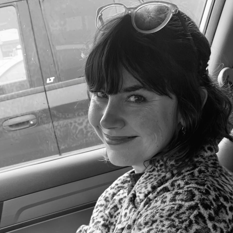 Black and white photograph of Lara Wesen smiling.