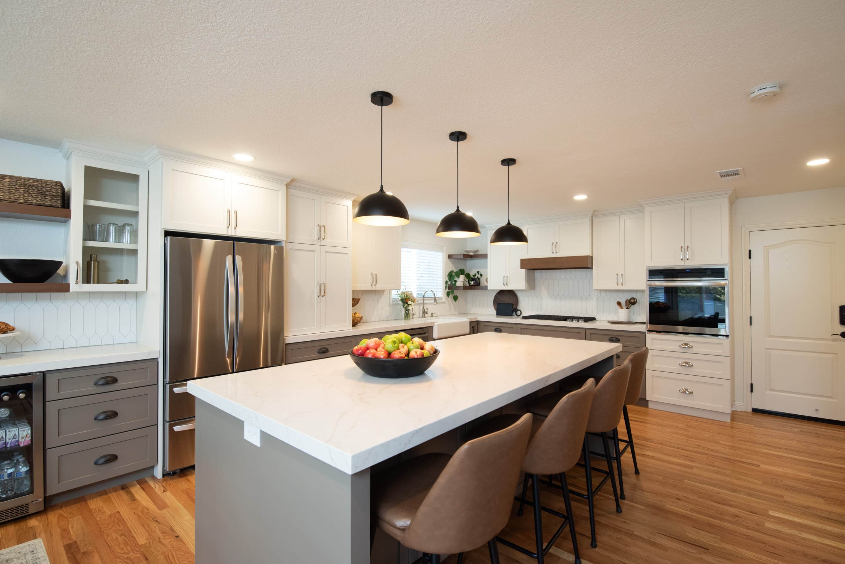 Kitchen with matte black faucet and marble countertop