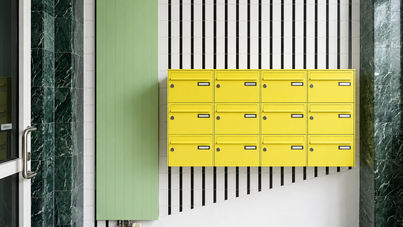 Bright yellow letterboxes in the GODU foyer with striped wall detailing