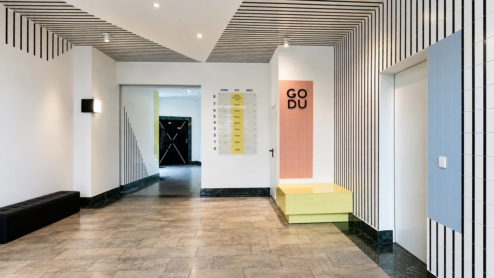 GODU foyer with colourful wayfinding, tiled walls and interior signage in Berlin-Tempelhof