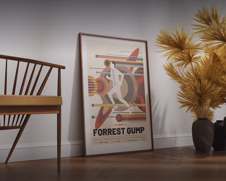 Framed Forrest Gump movie poster leaning against a wall between a wooden chair and a vase with dried yellow plants on a wooden floor.