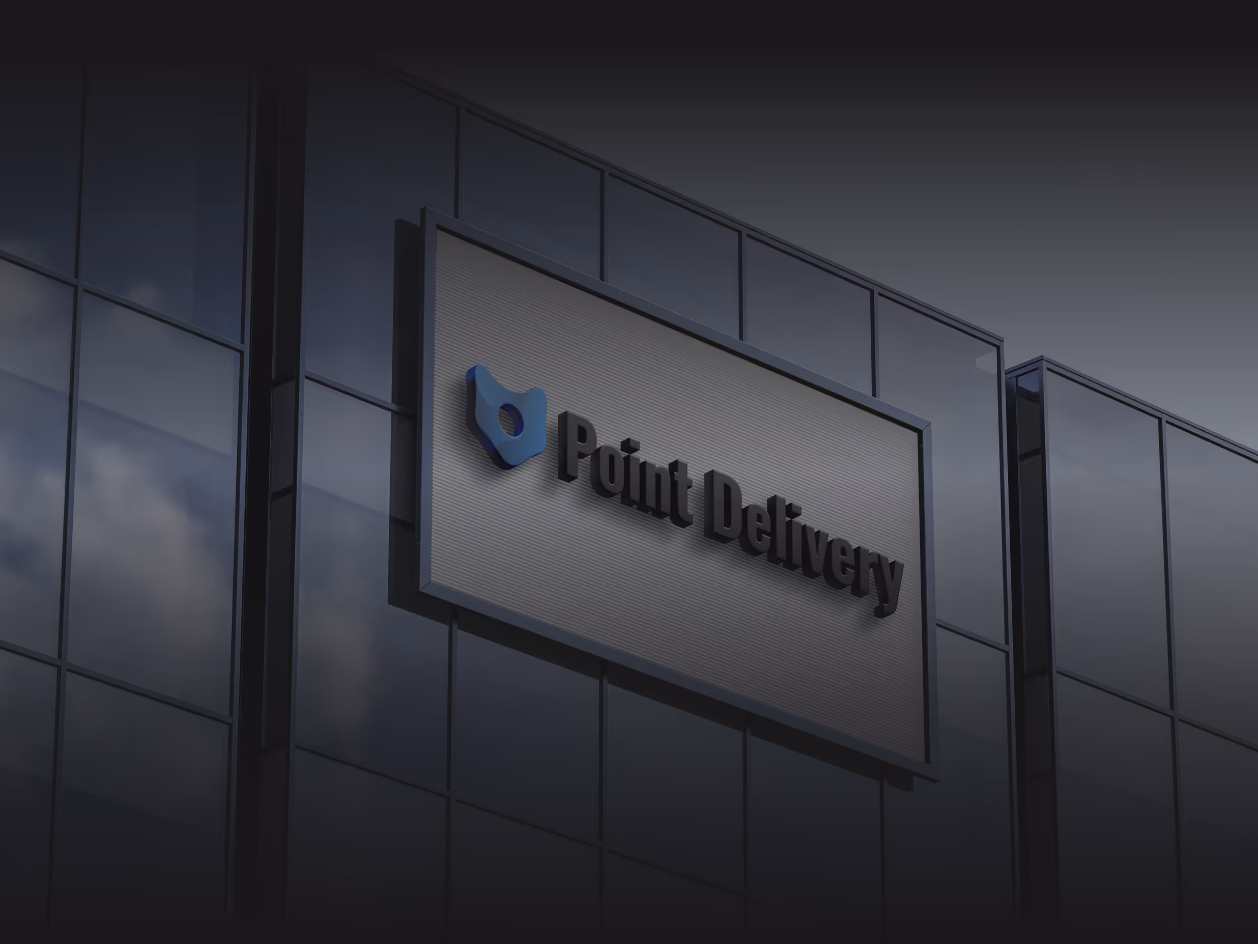 Modern glass building facade with a sign displaying the Point Delivery logo and name.