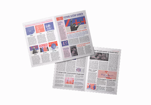 Two open pages of a colorful magazine or festival program with text and images, laid on a light background.