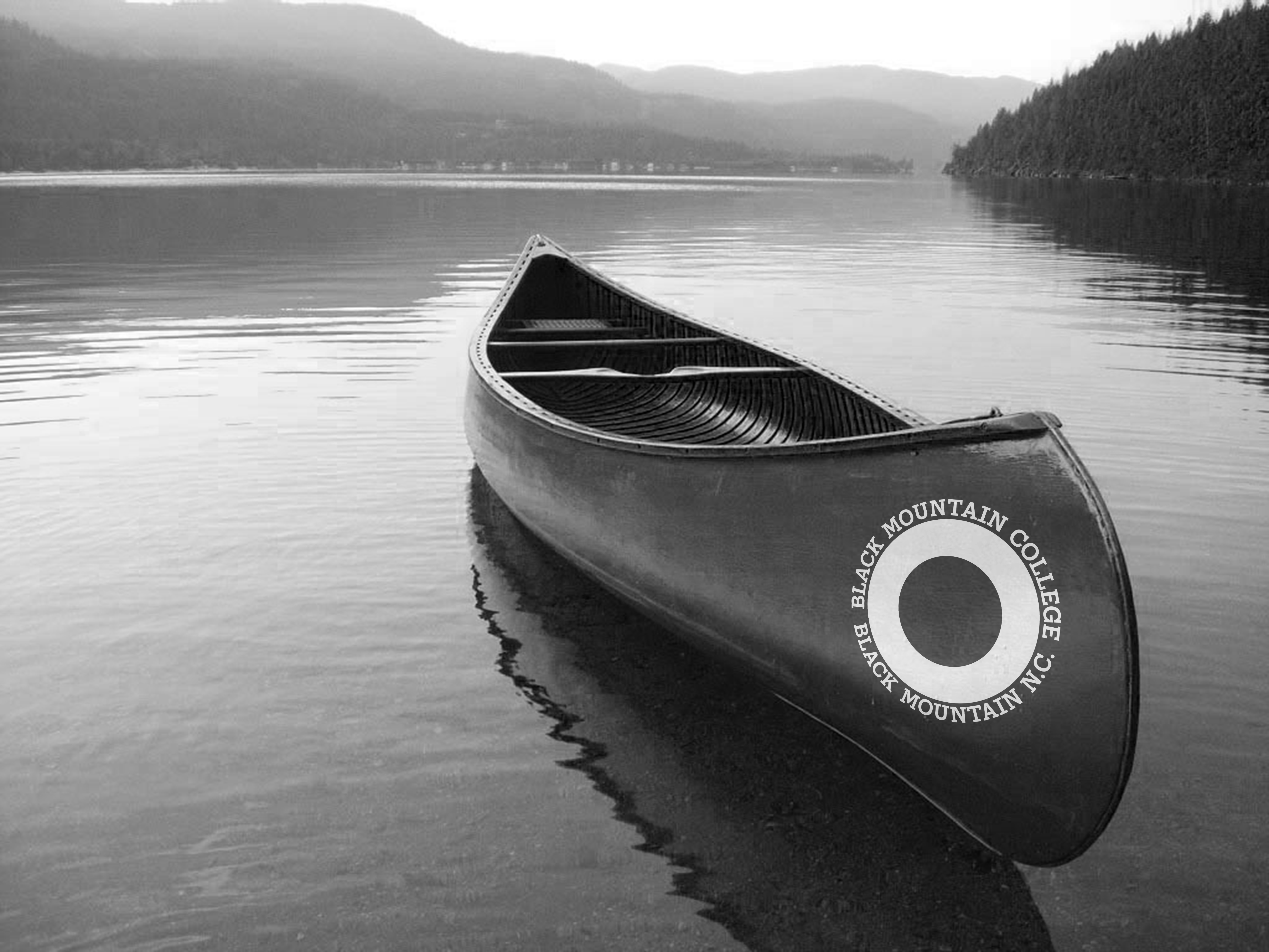 Image of a canoe on Lake Eden with the new BMC logo set in BMC45 on the side. 