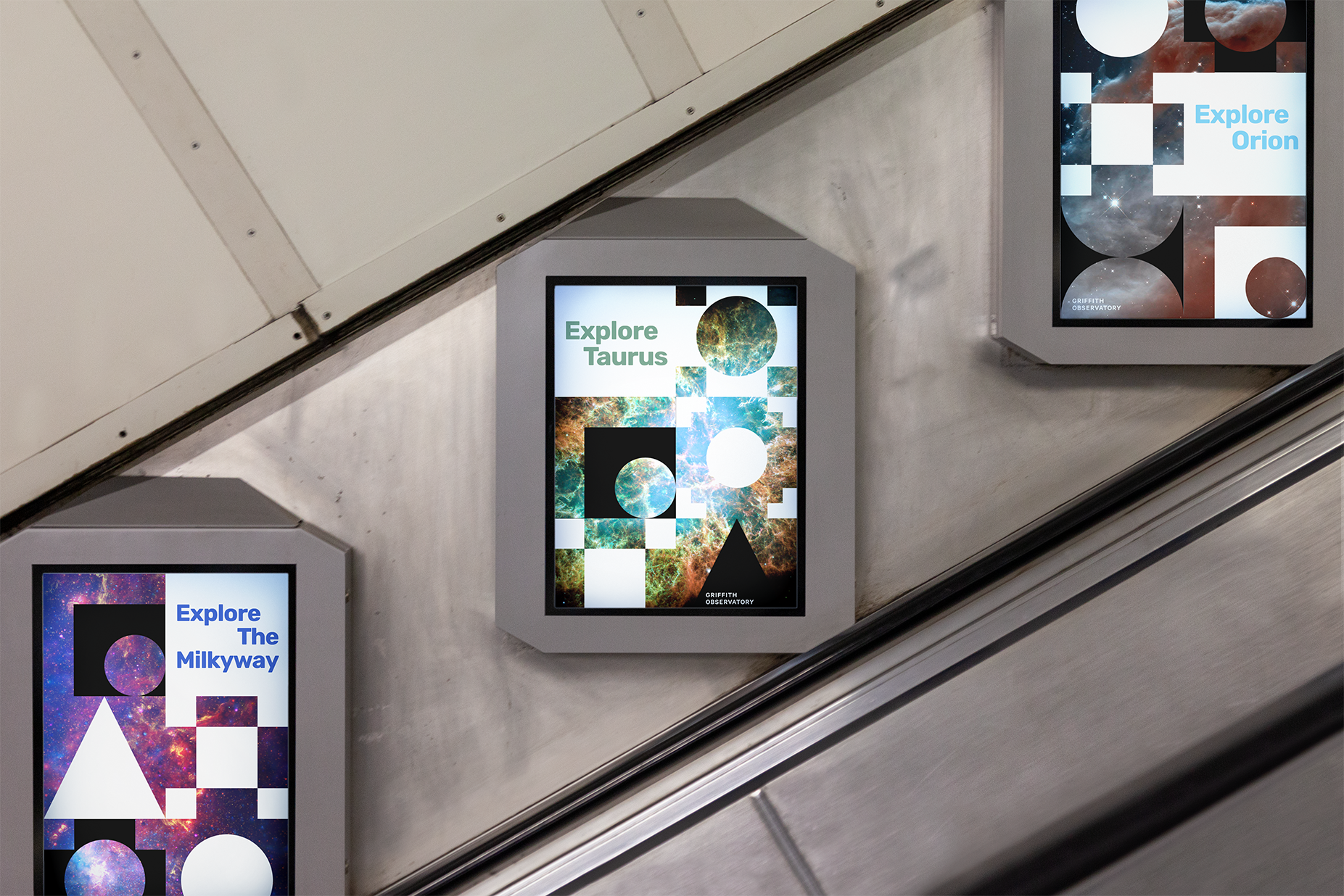 Image of three Griffith Observatory posters in a subway. The symbols show outer space imagery like stars and the galaxy. 