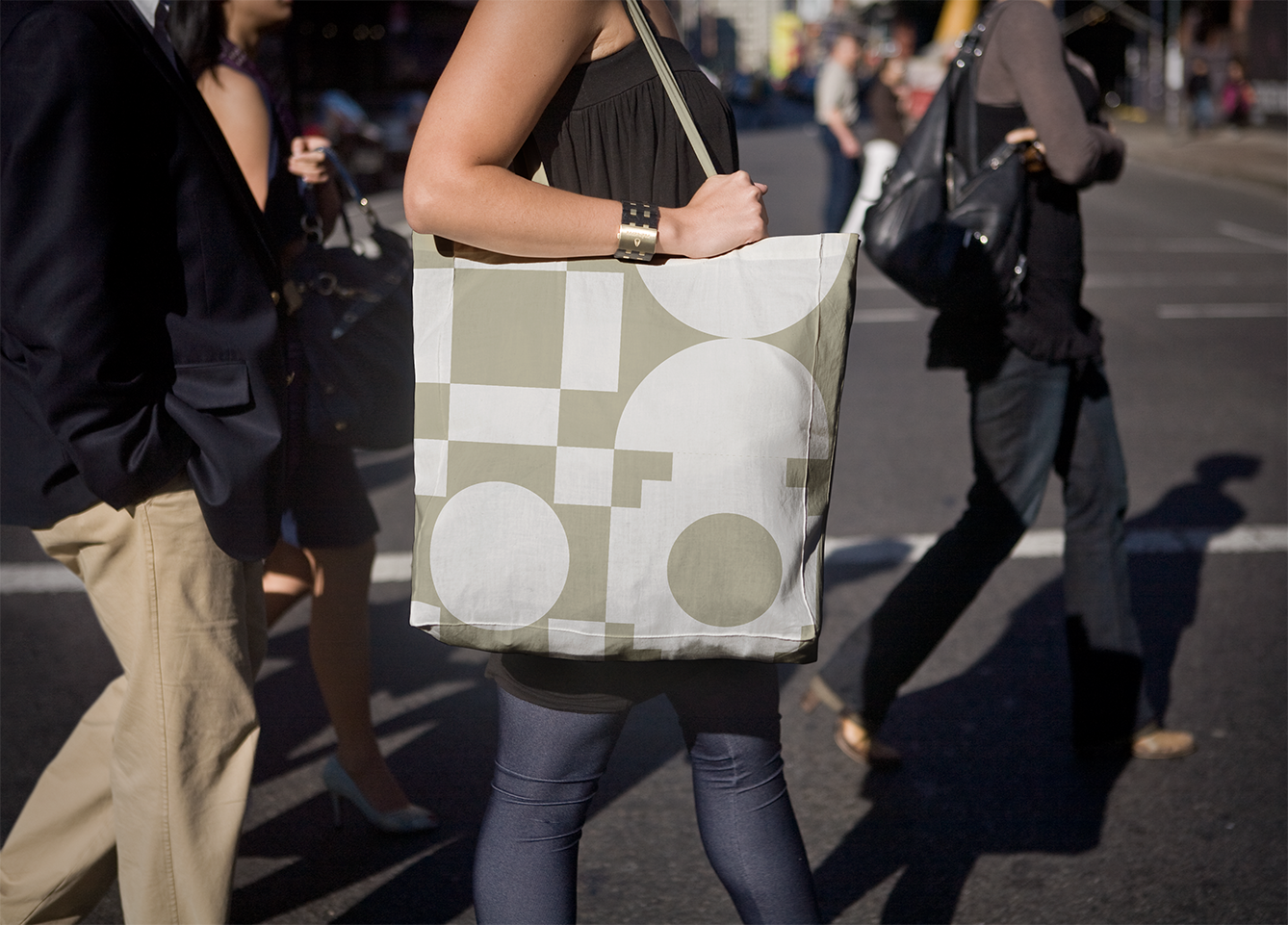 A Griffith Observatory tote bag with a pattern made up of four of the new brand symbols. 