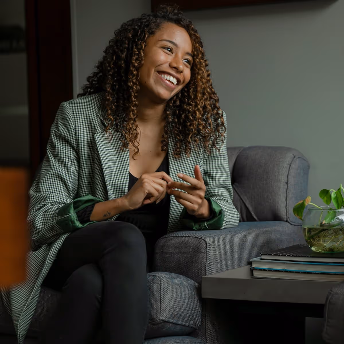 Smiling black female provider looking to her left