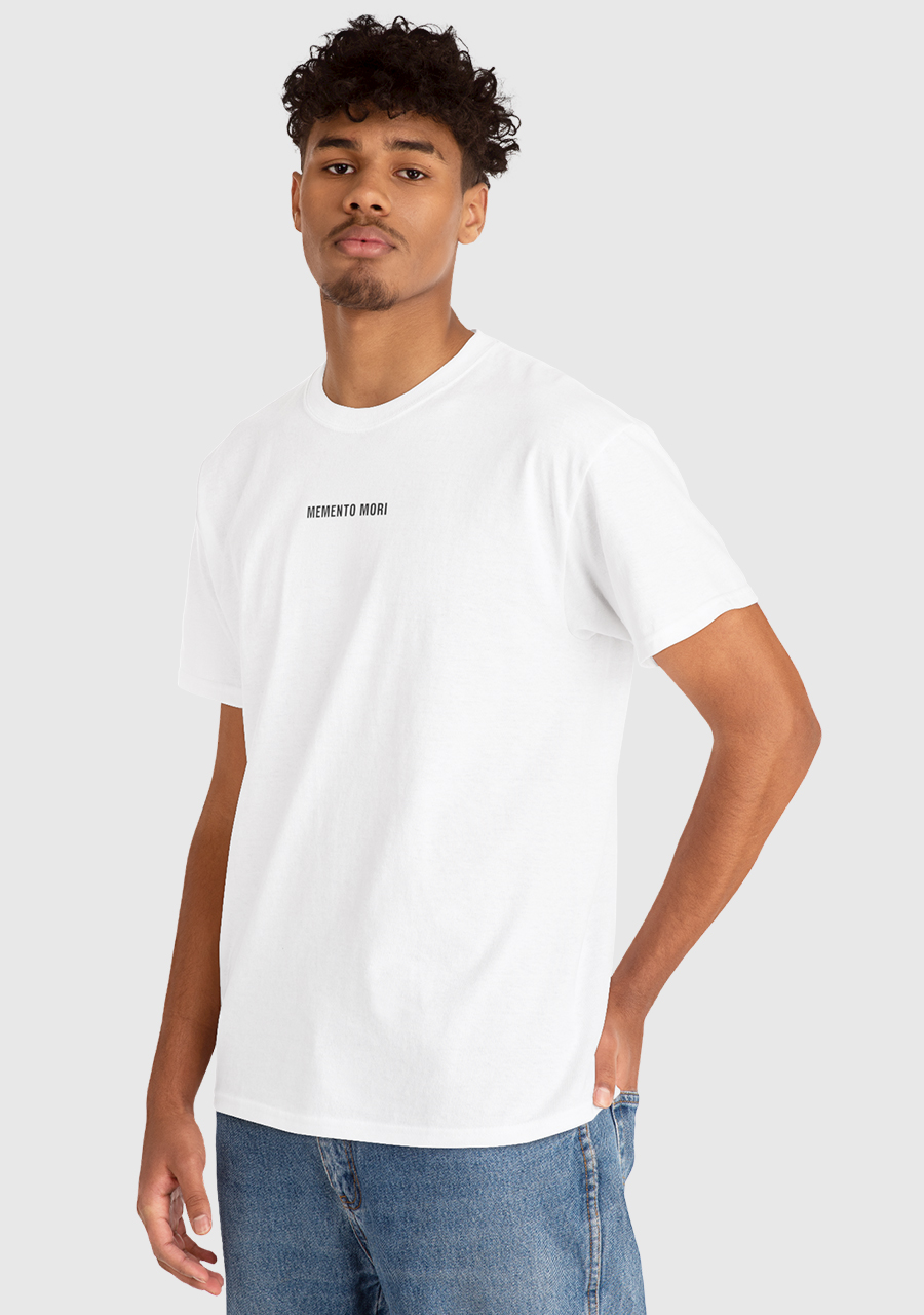 A man wearing a stoic tee shirt in white with black text that reads memento mori