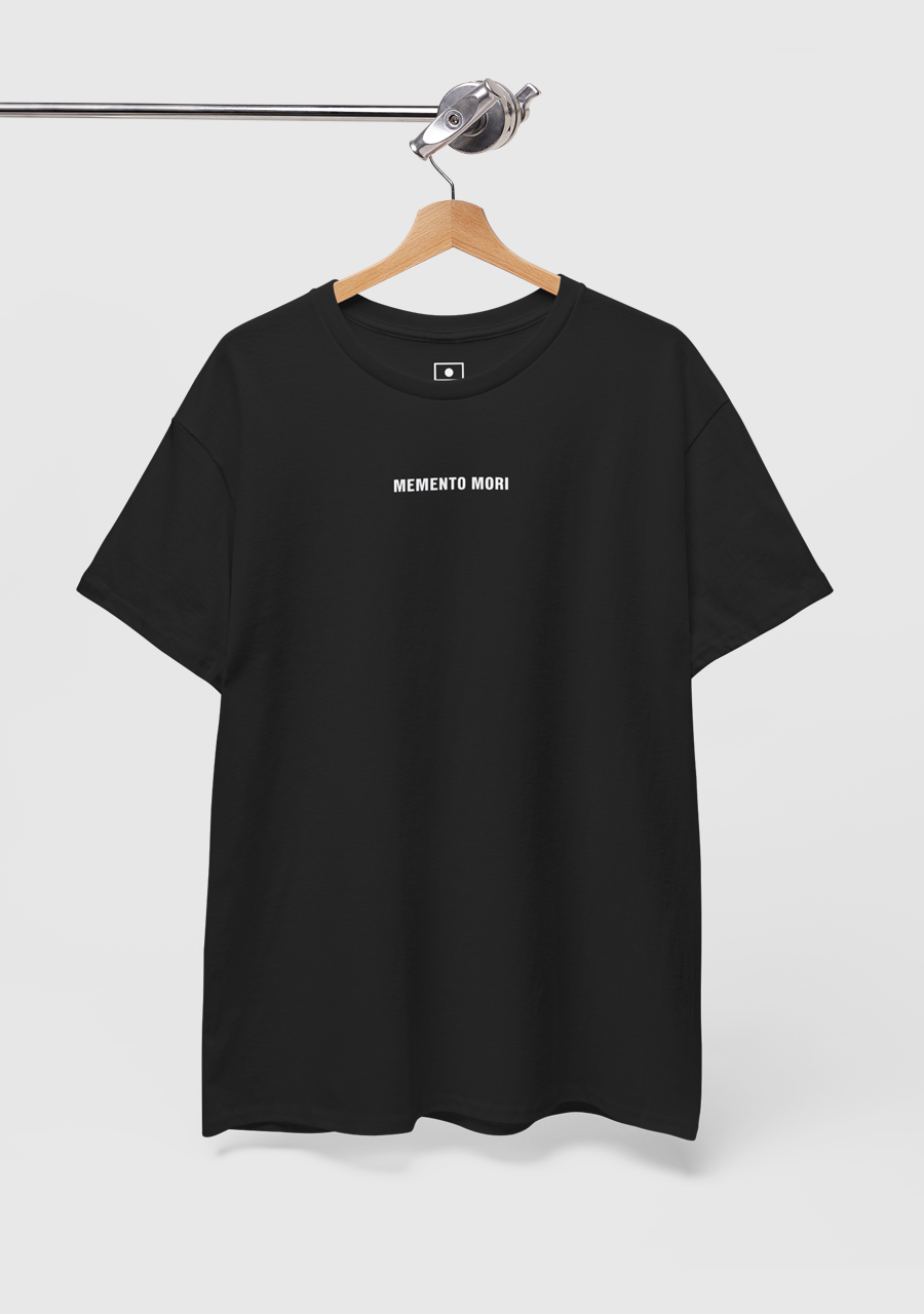 A black t-shirt with the Stoic saying Memento Mori printed on it.