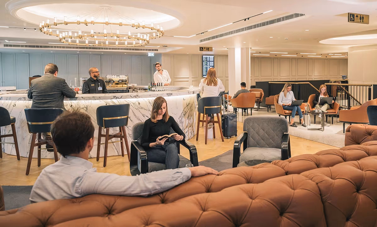 People sat in the airport lounge in London