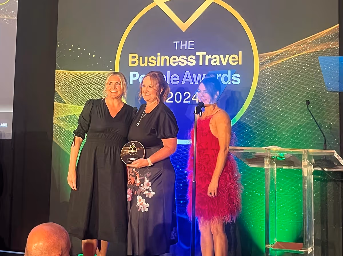 Donna Fitzgerald holding TMC Above and Beyond award | Clarity