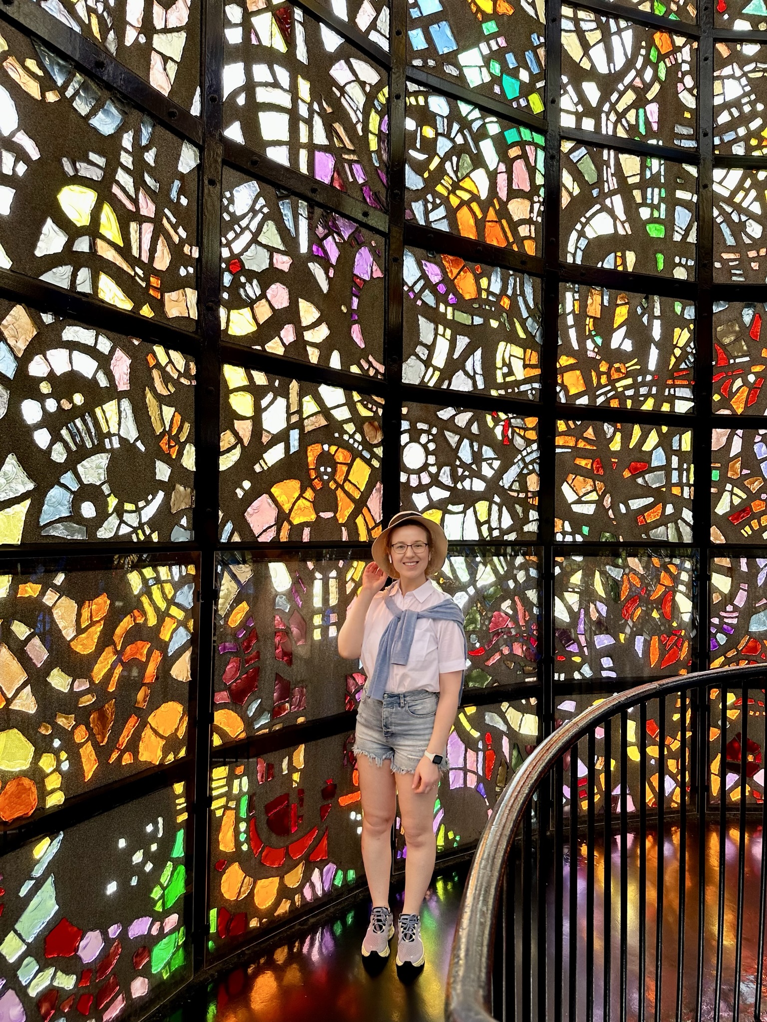 Mari-Alina Timoshchuk with a background of stained glass in The Symphony Structure