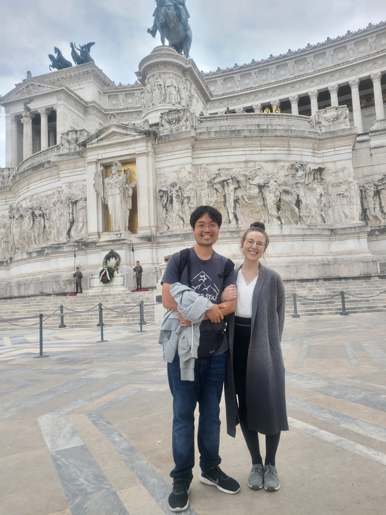 Mari-Alina Timoshchuk and Cassidy Sung in front of the wedding cake parliament building in Rome