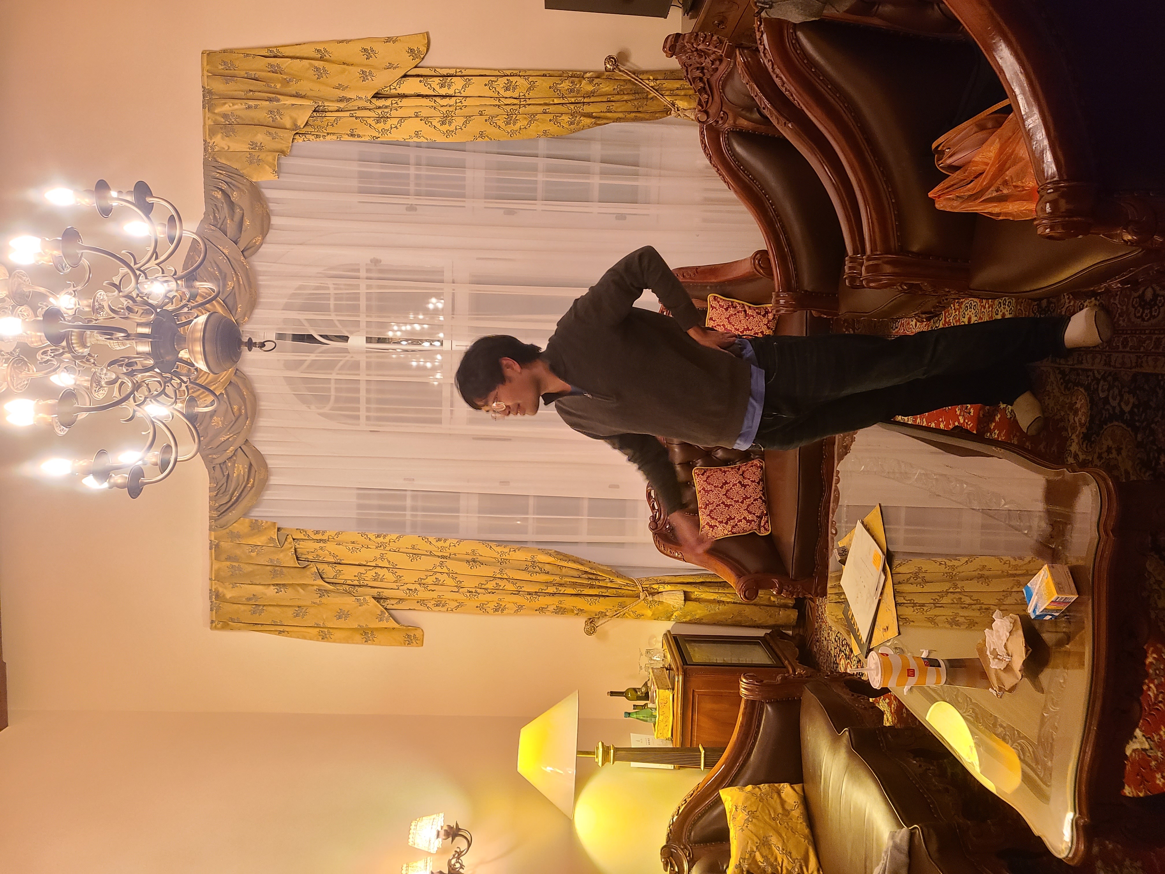 Mari-Alina Timoshchuk in a hotel in Prague with a large window behind her