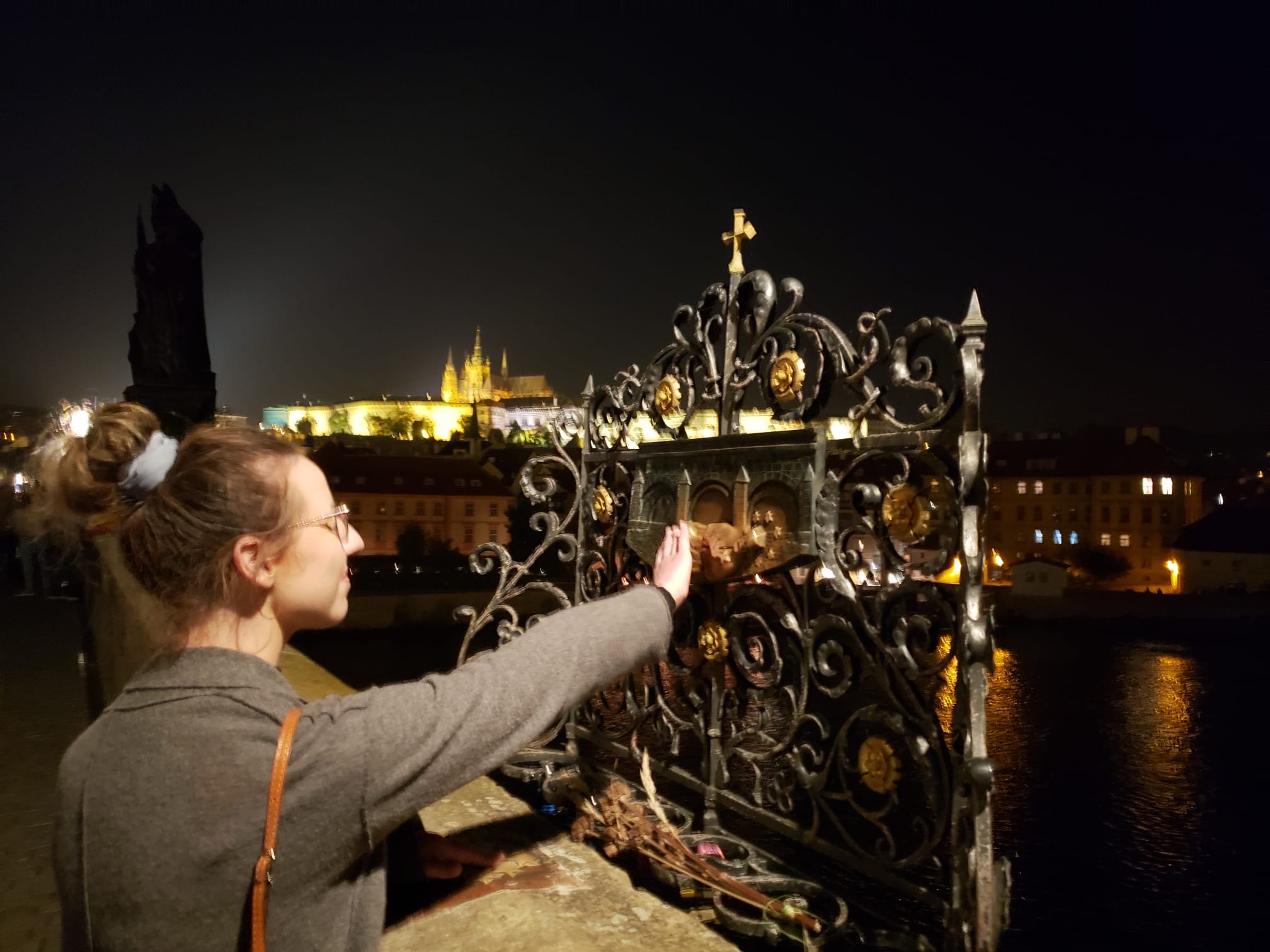 Mari-Alina Timoshchuk at the Charles Bridge in Prague making a wish