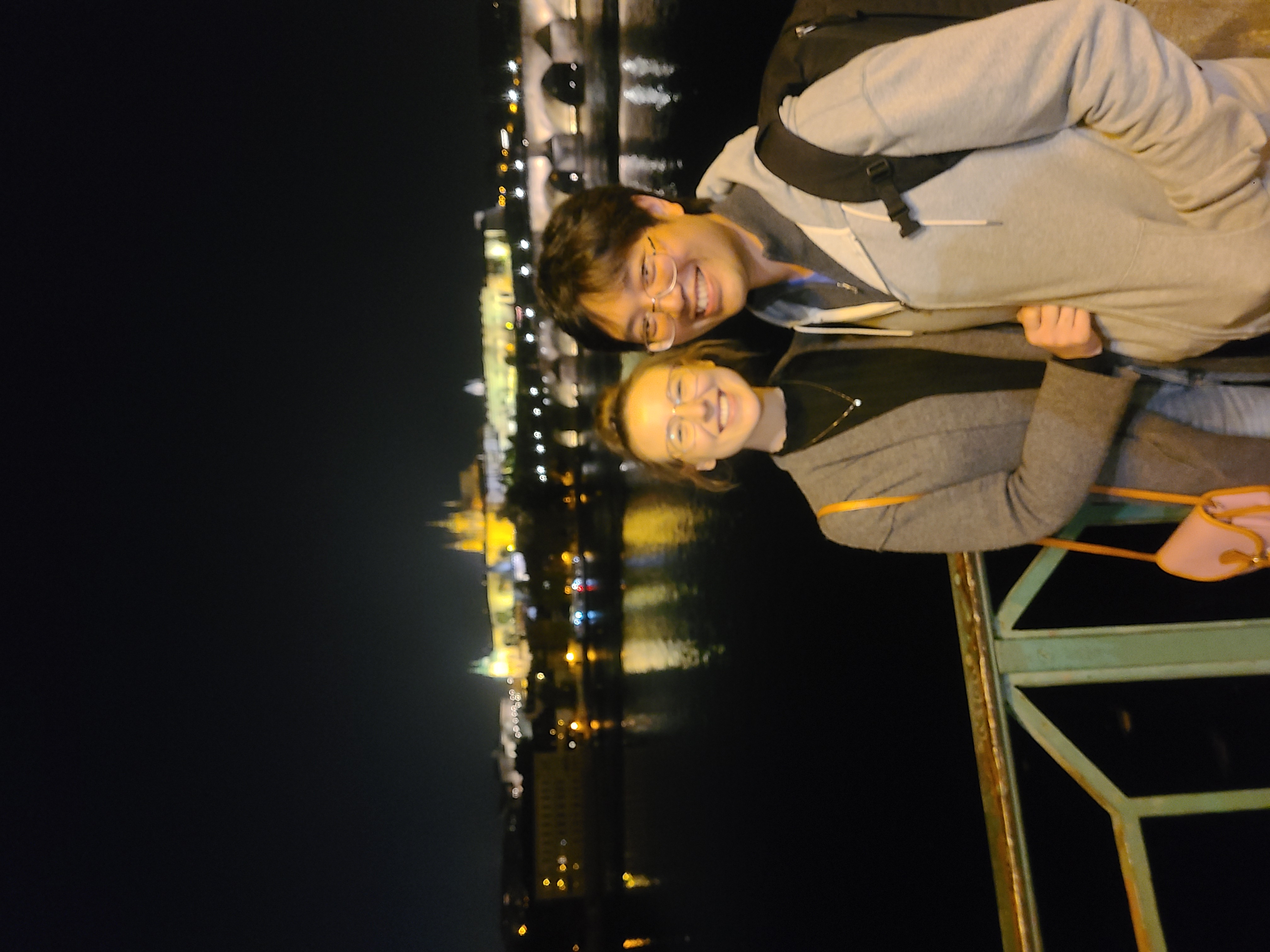Mari-Alina Timoshchuk and Cassidy Sung at the Charles Bridge in Prague at night