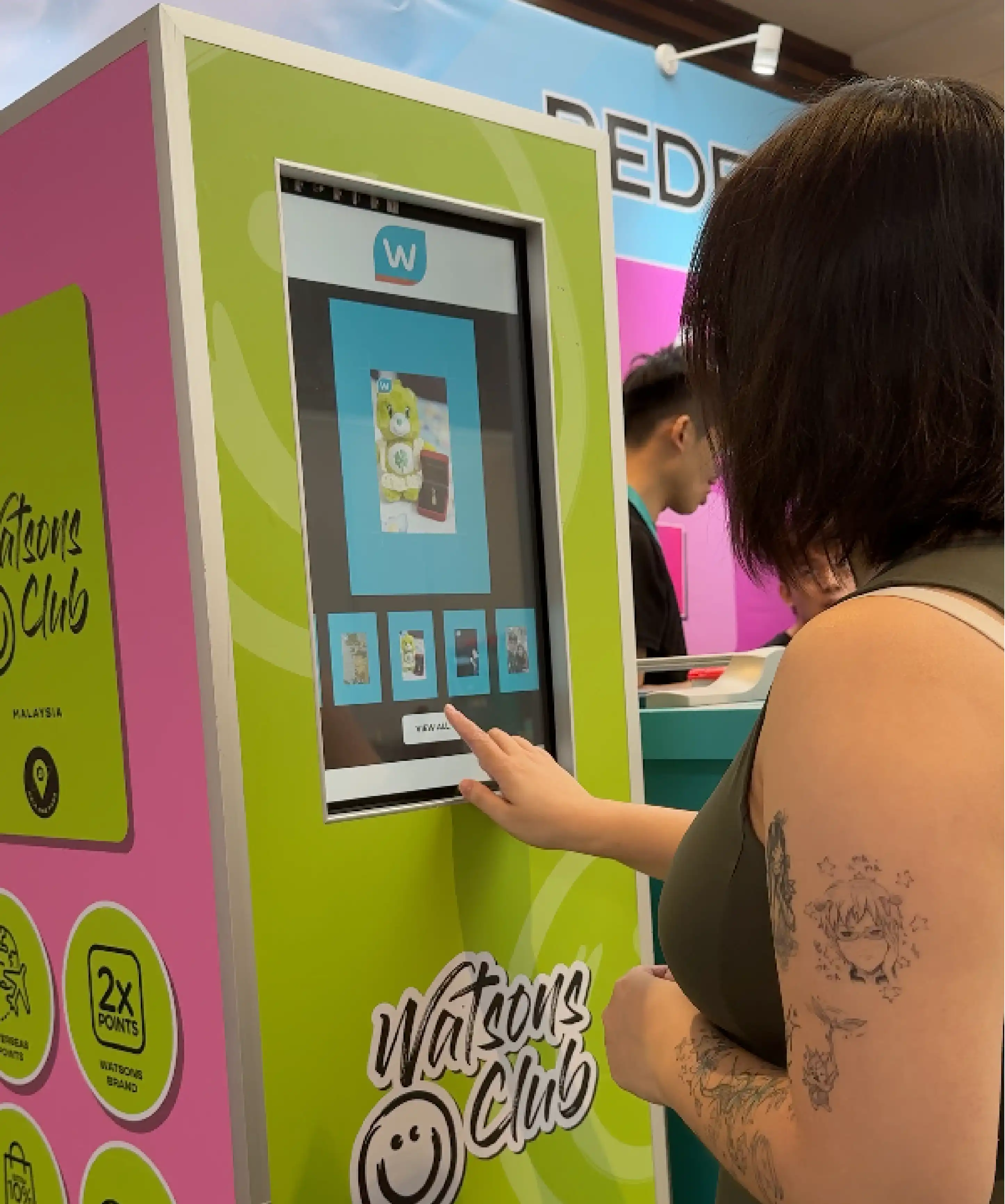 Watsons Beautopia MOBI photo booth guest using smartphone Malaysia retail activation