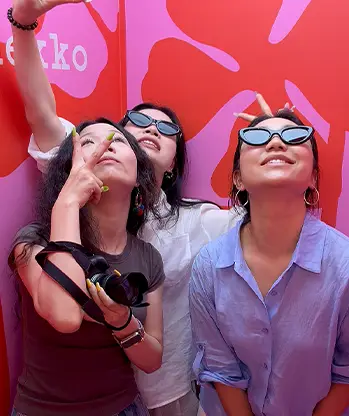 Marimekko visitors looking up at high-angle camera inside booth Malaysia