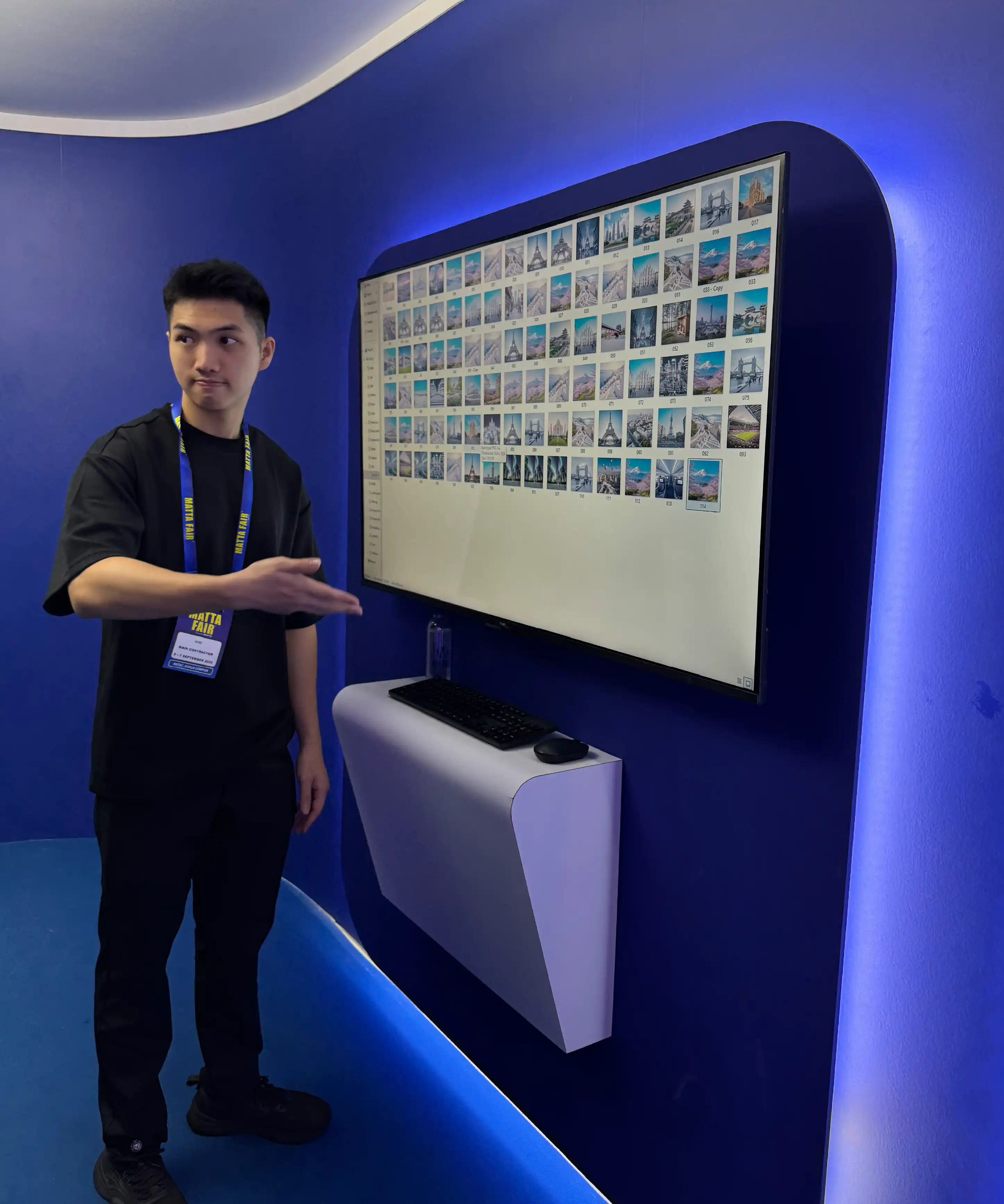 MAS MATTA Fair staff demonstrating AI destination photobooth experience