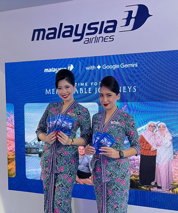 MAS MATTA Fair group photo with AI-transformed travel destination background