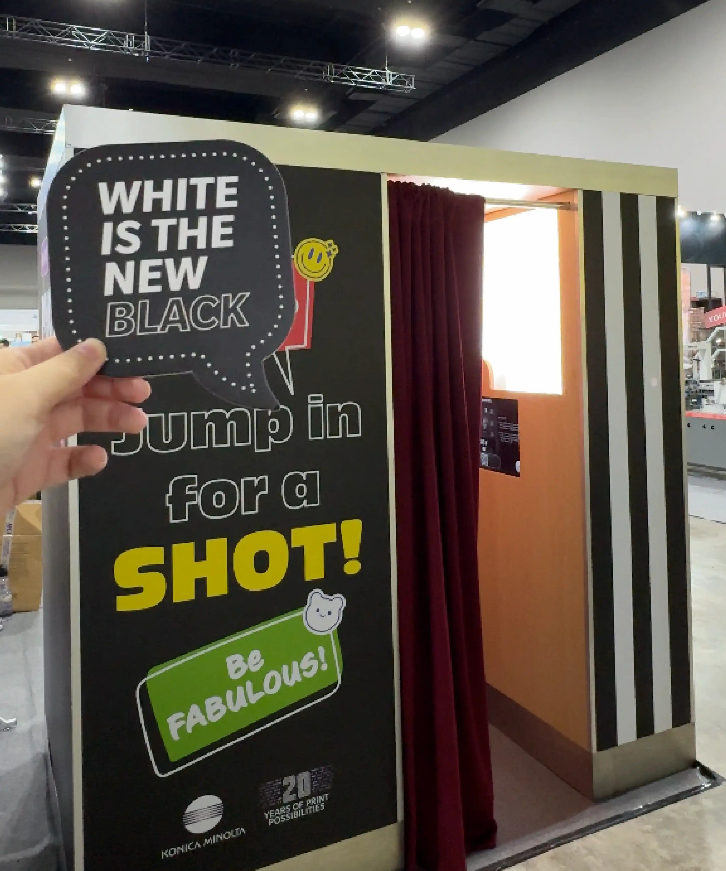 Konica Minolta Print Tech 2025 exhibition booth with branded monochrome photobooth activation
