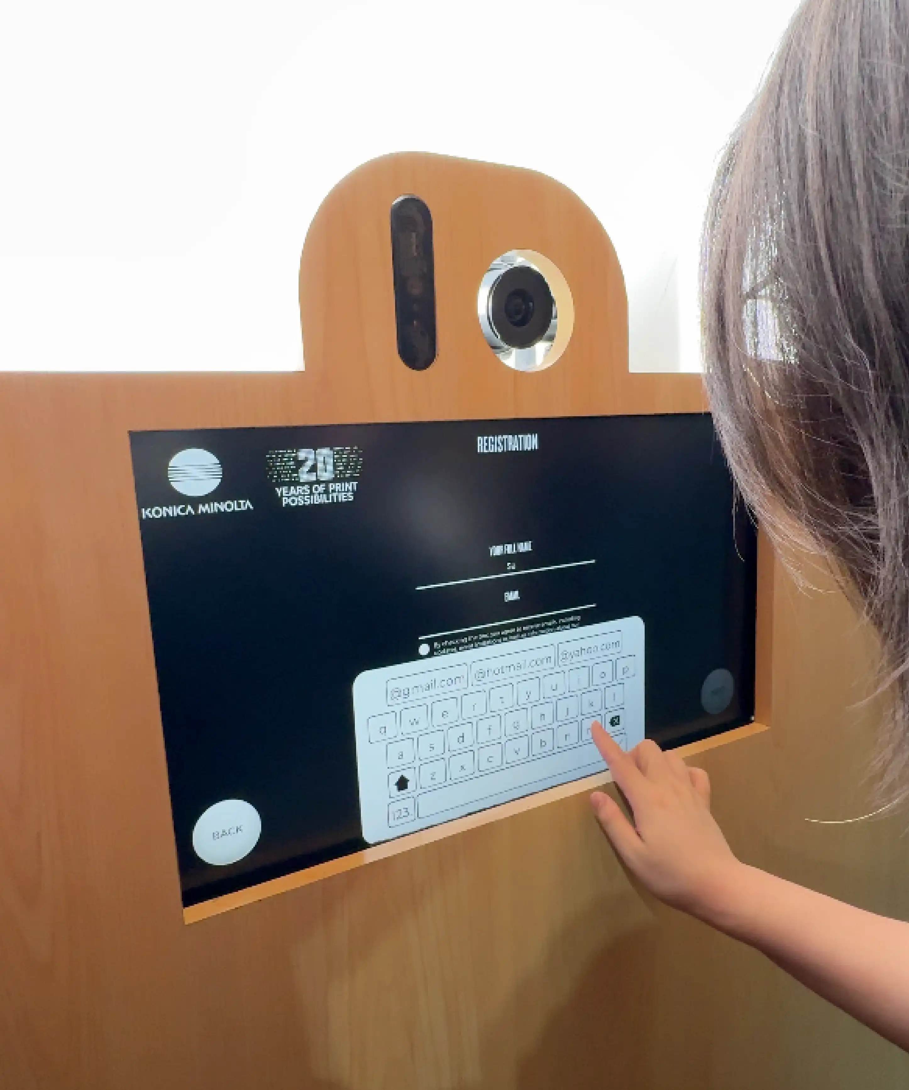 Konica Minolta Print Tech 2025 visitors experiencing monochrome photobooth white-based ink demonstration