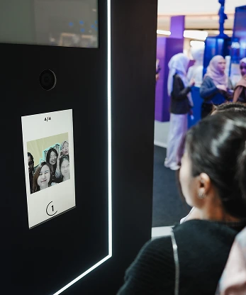 Kiehl's Bones' World Roadshow AI photo booth guest posing in front of screen Malaysia