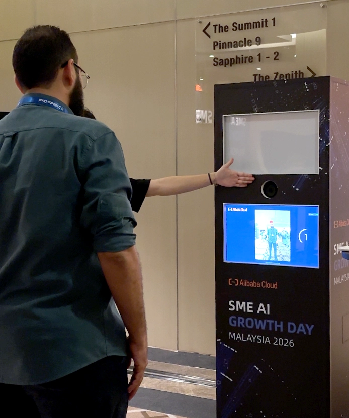Attendee interacting with the SME AI Growth Day kiosk screen.
