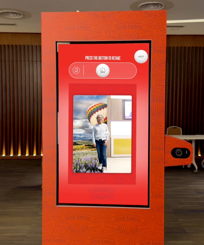 Great Eastern kiosk displaying a captured souvenir portrait on screen.