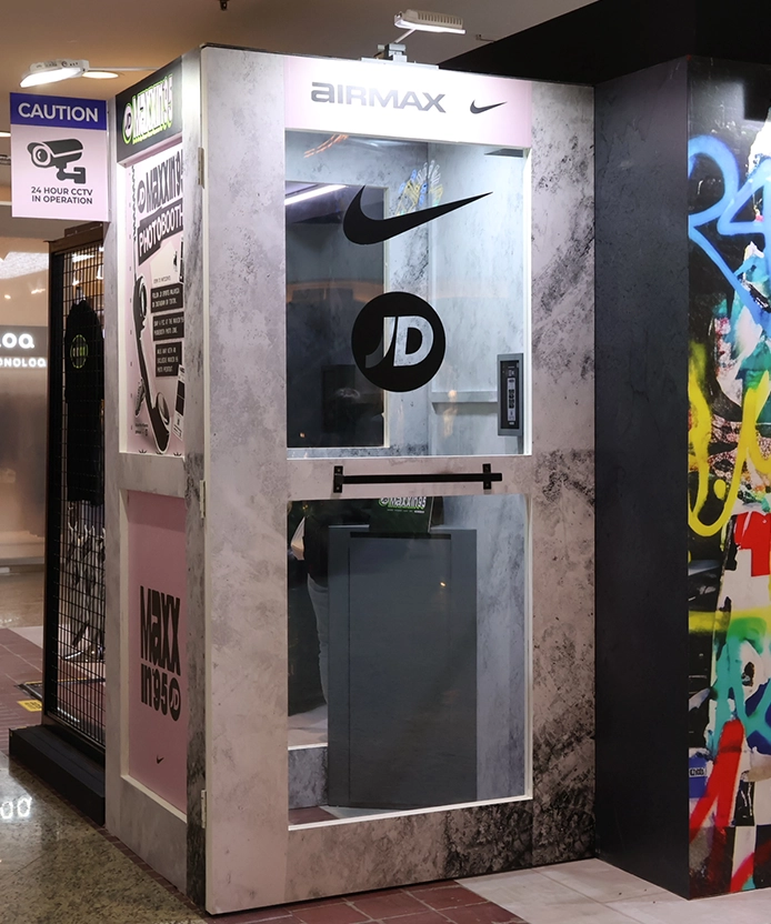 JD x Nike photo booth installation with Maxxin 95 branding in a mall.