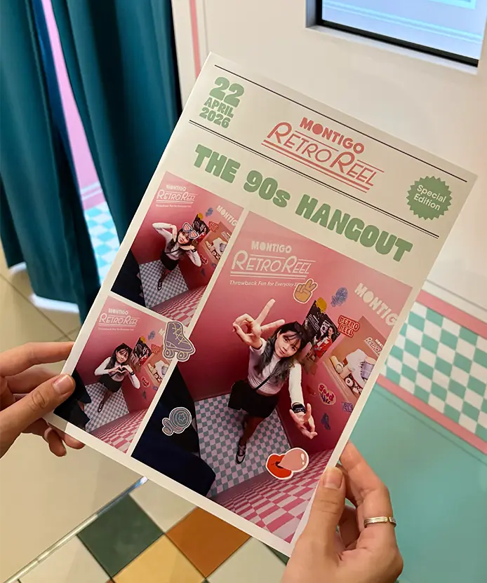 Hands holding the laser-printed Montigo Retro Reel newspaper-style photo, 90s Hangout edition