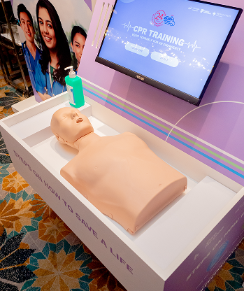 Wide shot of the IHH CPR training booth setup, Malaysia