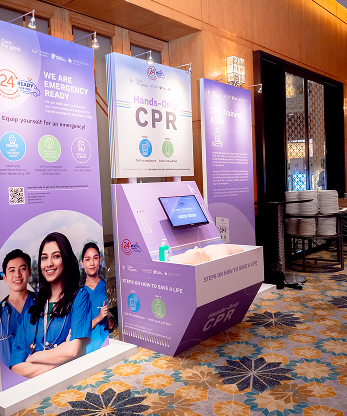 IHH CPR training booth setup with interactive touchscreen display, Malaysia