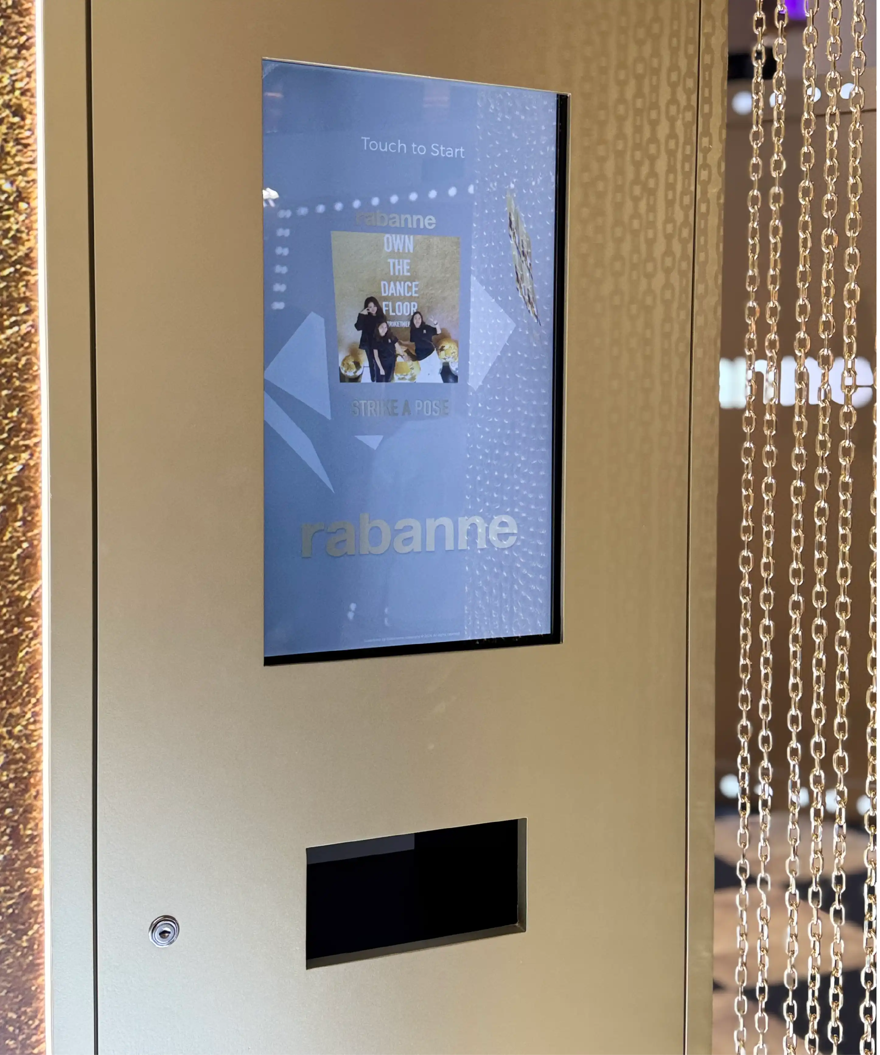 Guest holding the printed Paco Rabanne photo booth output, Mid Valley, Kuala Lumpur