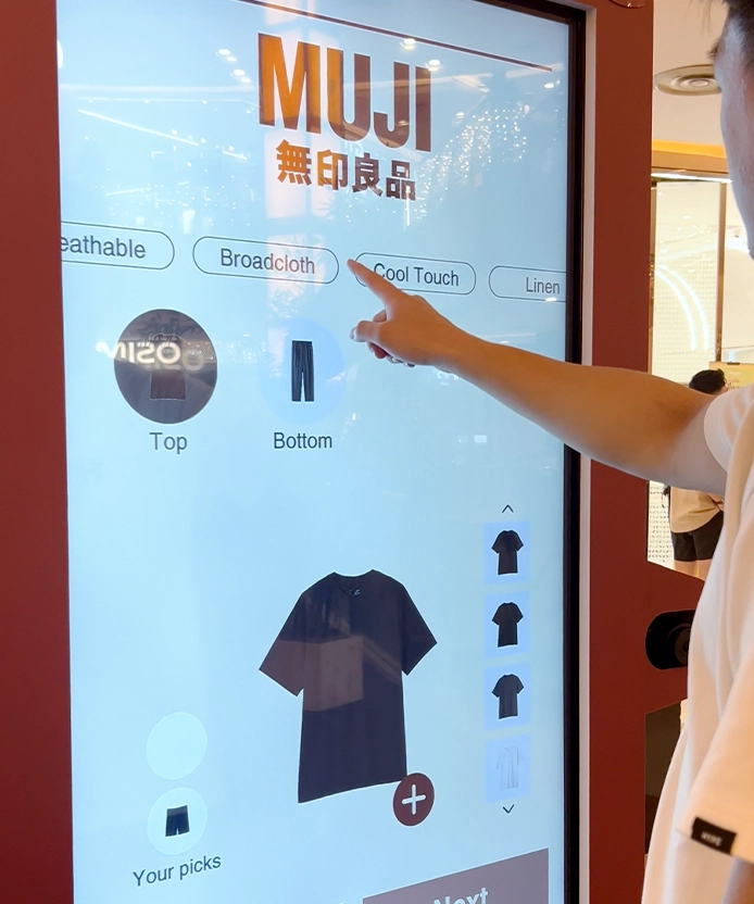 Shopper selecting fabric type on the MUJI SS26 digital fitting room outfit builder kiosk, Malaysia