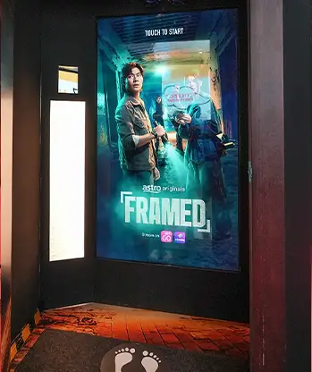 Astro Framed interactive game setup with large touchscreen display.