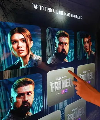 User playing the Astro Framed interactive game.