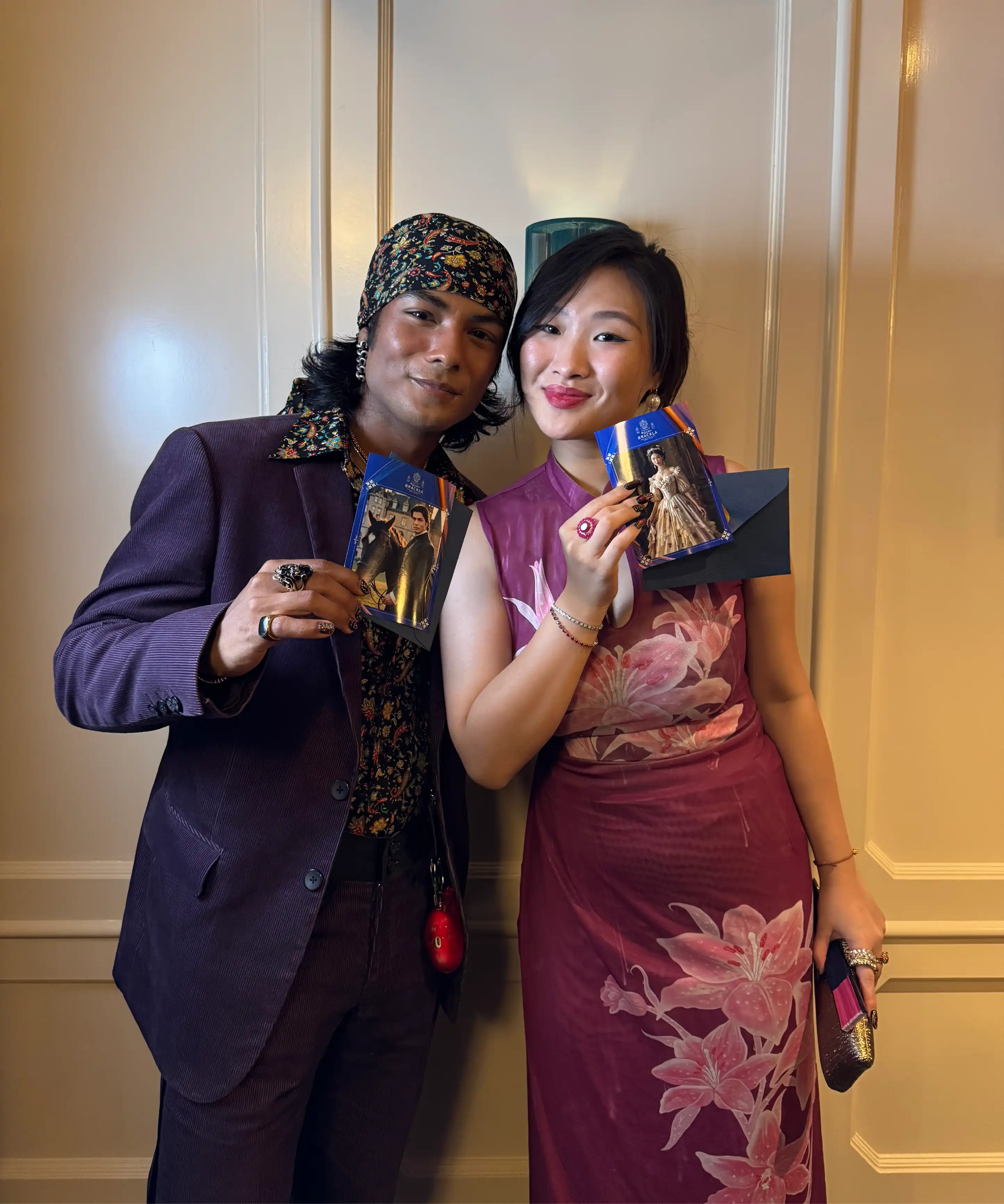 Guests holding printed Royal Brackla AI portrait photo cards, Malaysia event