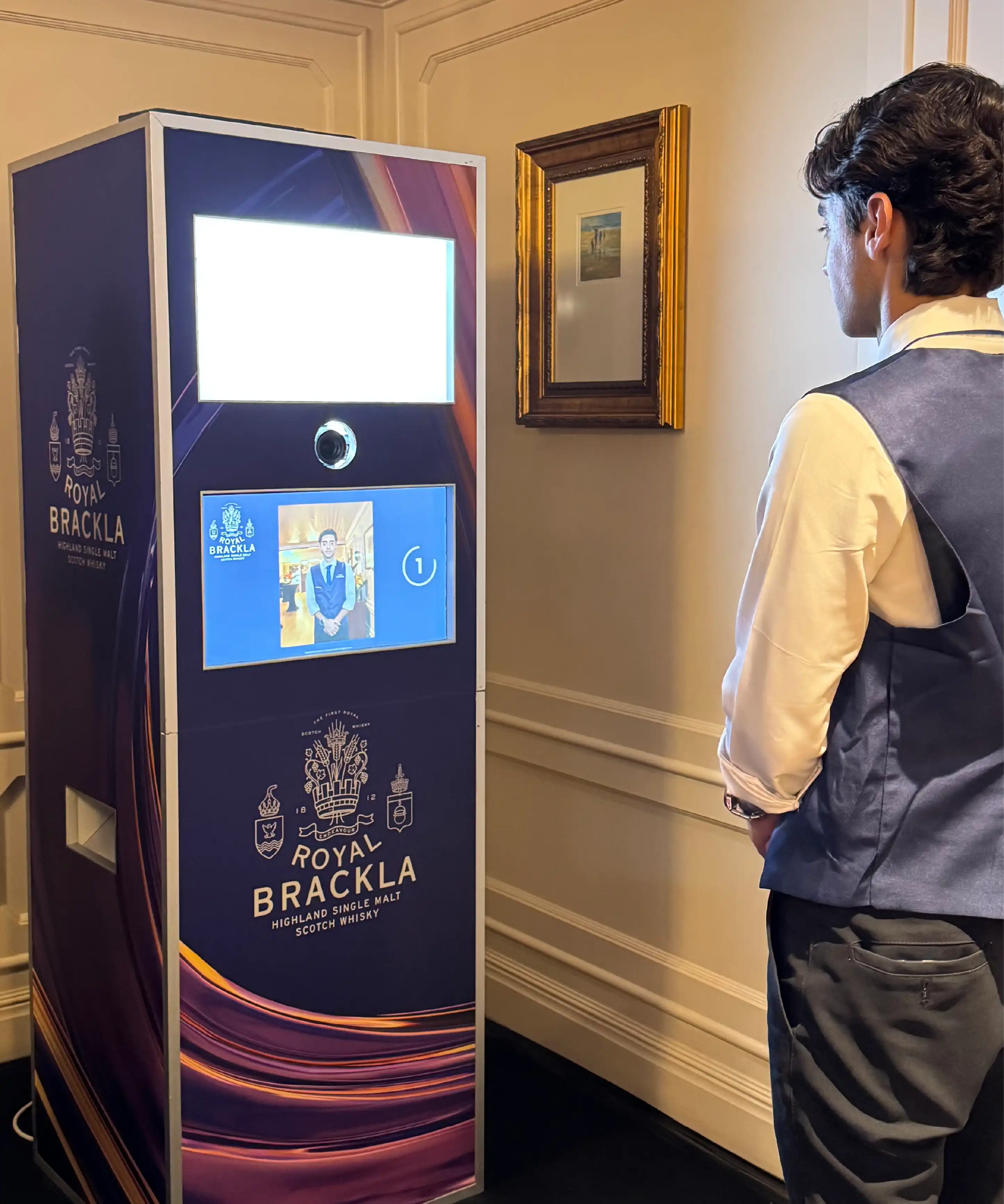 Guest using Royal Brackla Instabox photo booth touchscreen, Malaysia whisky event