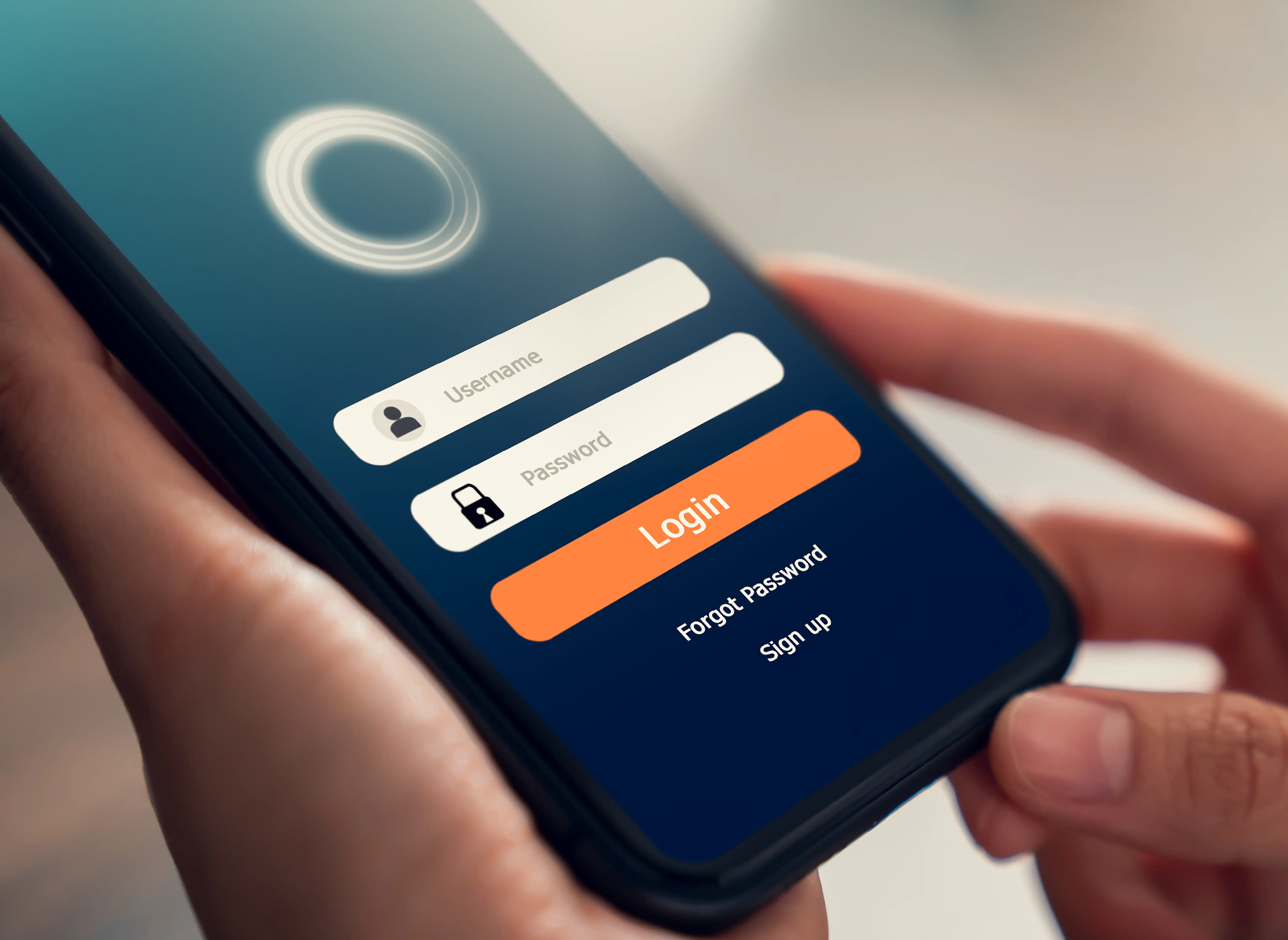 Hands holding a smartphone showing a login and registration screen