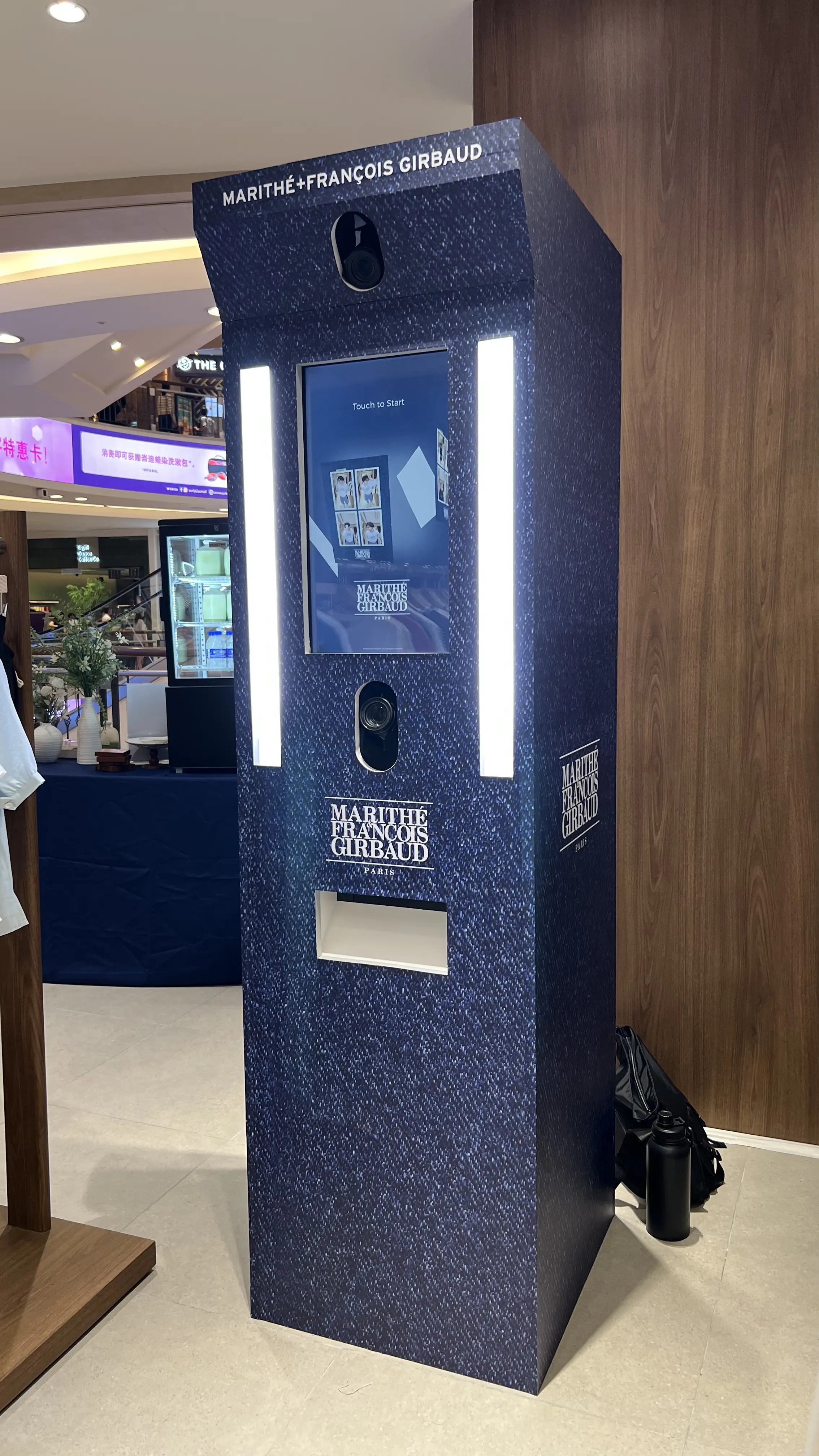 Denim-textured IN:FRAME photo booth with Marithé + François Girbaud branding in the mall
